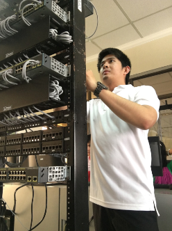 Dr. Francis Jesmar P. Montalbo working with network and computing infrastructure